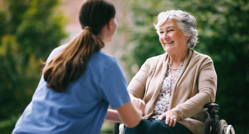 Nurse with Resident at Charlotte Memory Care Community